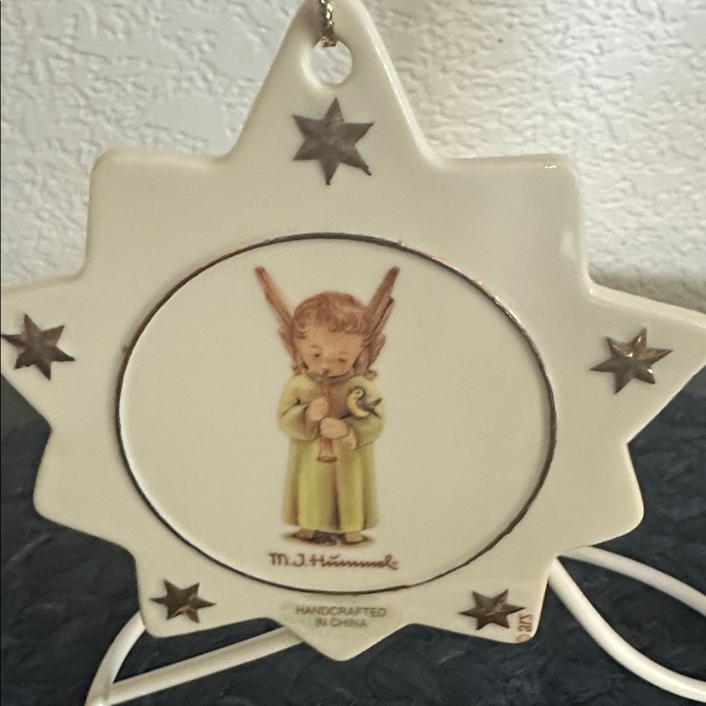 M.J. Hummel Porcelain Star Ornament With Angel Playing Horn & 
Bird & Gold Stars
